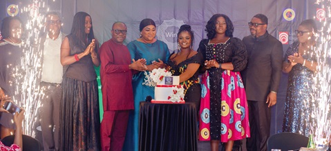 David Boadi Asamoah (3rd from left), Deputy Managing Director, being assisted by Nana Agyakoma Difie II (4th from left), Mamponghemaa, as well as Alberta Amankwaa, President, ECG WinE, and Georgette Emefa Fugah, Board Member, ECG, to cut the cake