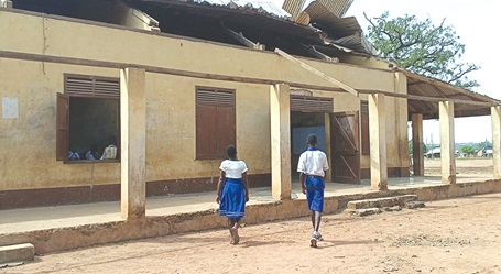 A school building with the roof ripped off by the rainstorm