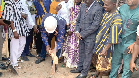Emmanuel Allotey Addotey (with the pickaxe), MCE for Ga Central, cutting the sod for work on the projects to begin