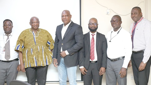 Kingsley Mate-Korley (left), General Manger, G-Pak, with Cosmas Anpengnuo (2nd from left), acting Executive Secretary; Ato Afful (3rd from left), MD, GCGL; Franklin Sowah (right), Director, Marketing, GCGL; Thomas Martey (3rd from right), Head of Audit, PCSRC, and Nii Yeboah Burgesson (2nd from right), Public Affairs Manager, PCSRC, after the meeting. Picture: BENEDICT OBUOBI