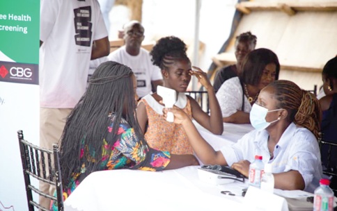 A health worker (right) attending to a participant