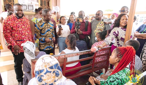 Kwabena Mintah Akandoh (2nd from left),  Minister of Health, speaking to some patients at the hospital. Standing left is Michael Kpakpo Allotey,  Chief Executive of AMA