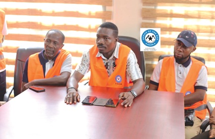 Ignatius Godfred Dordoe (middle), District Chief Executive for Shai-Osudoku, addressing the media