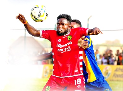 • Kotoko’s Albert Amoah shield’s the ball away from his marker during yesterday’s game