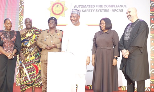 Muntaka Mohammed-Mubarak (3rd from right), Minister for the Interior, launching the AFCAS. Assisting him are Daniella Mawusi Ntow Sarpong (3rd from left), Chief Fire Officer; Nana Ofori Ahenkan II (2nd from left), Council Chair, GNFS, and some partners of the project. Picture: BENEDICT OBUOBI