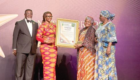 Joyce Bawa Mogtari (2nd from left), Special Aide to the President presenting a citation to Hajia Rabiatu Abubakari (2nd from right), of GURUNPAGA MALTITI A. ENTERPRISE LTD as the best shea trader of the year during the awards ceremony, while Dr Andy Osei Okrah (left) CEO of aaTCDA looks on