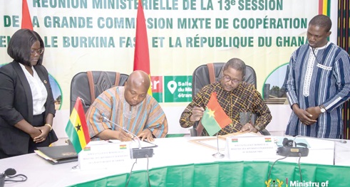 Samuel Okudzeto Ablakwa (2nd from left), Minister of Foreign Affairs signing the agreements with his Burkinabe counterpart, Karamoko Jean-Marie Traoré (2nd from right)