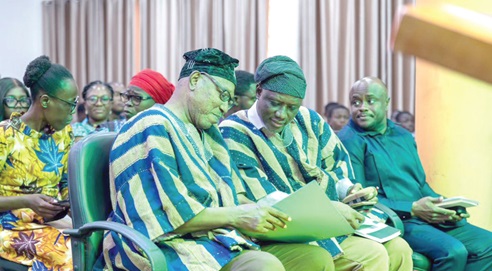 Ziblim Alhassan Betintiche (right), Executive Director of the Ghana Library Authority (GhLA), interacting with Dr Clement Abas Apaak, Deputy Minister of Education and MP for Builsa South, during the event