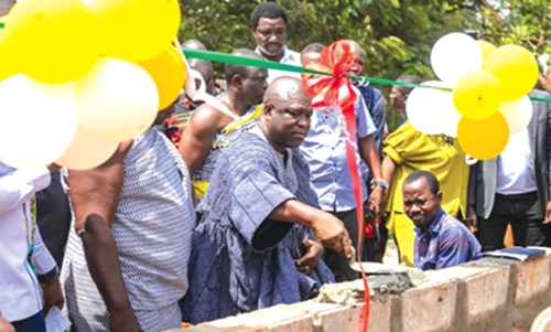 James Gunu (in smock), Volta Regional Minister, cutting the sod for the construction of the project