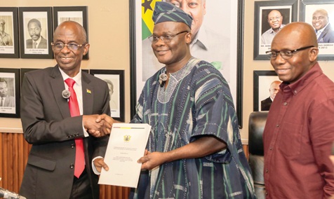 Johnson Asiedu-Nketiah (left), Chairman of the committee, presenting the report to Ahmed Ibrahim (middle), Minister of Local Government, Chieftaincy, and Religious Affairs, while Alhaji Amin Abdul-Rahaman, Chief Director, Ministry of Local Government, Chieftaincy and Religious Affairs, looks on. Picture: ELVIS NII NOI DOWUONA 