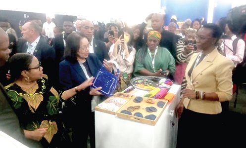 Patricia De Lille, South African Minister of Tourism, admiring a product at the exhibition mounted at this year's Meetings Africa event in Johannesburg