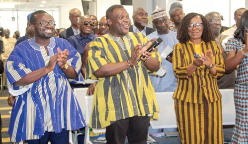 Sam Nartey George (middle), Minister of Communications, Digital Technology and Innovations, applauding with Edmund Yirenkyi Fianko (left), Director-General, NCA, and Mavis A. Ampah (right), Board Chair, NCA, after launching the NCA 30th anniversary. Picture: ERNEST KODZI
