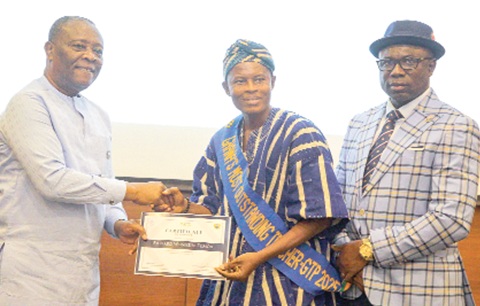 Prof. K.T Oduro (left), Technical Advisor  to the Minister of Education, presenting an award to Richard W. Tiimob (middle), Ghana’s Most Outstanding Teacher 2025. With them is Dr Christian Addai-Poku, Registrar, National Teaching Council. Picture: CALEB VANDERPUYE