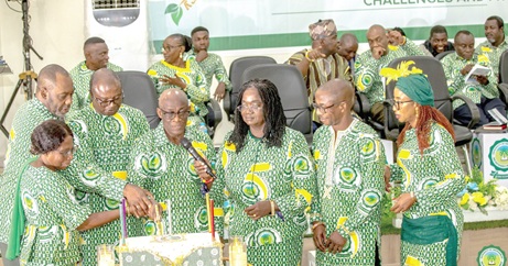 Dignitaries cutting the anniversary cake at the event