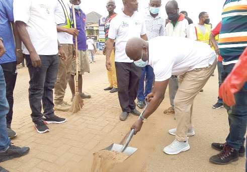 Ahmed Ibrahim, Minister of Local Government, Chieftaincy and Religious Affairs, leading the clean-up exercise in Sunyani