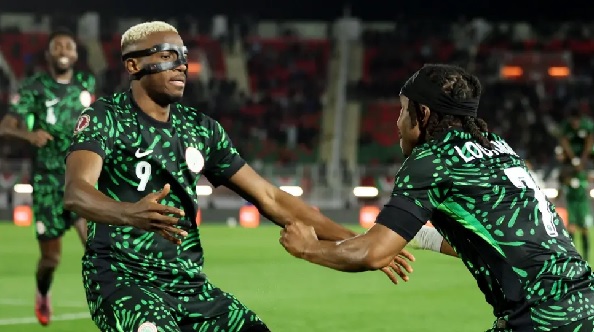 Victor Osimhen celebrates with teammate Ademola Lookman 