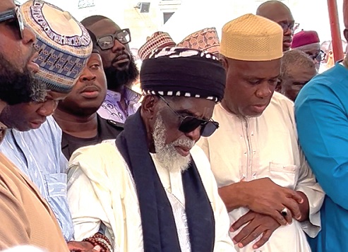 Usmanu Nuhu Sharubutu (middle), National Chief Imam, leading the burial prayers during the final rites Picture: CALEB VANDERPUYE 