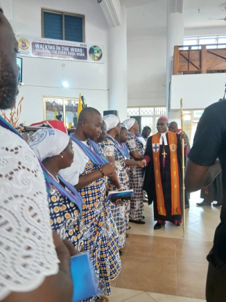 Most Rev Professor Johnson Kwabena Asamoah-Gyadu, Presiding Bishop of The Methodist Church Ghana, congratulating connexional officers of the Methodist Guild after their induction