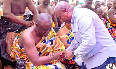 President John Dramani Mahama (right) exchanging pleasantries with Osagyefo Oseadeeyo Agyemang Badu, President of the Bono Regional House of Chiefs, during the "Thank you" visit
