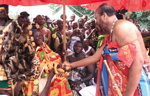 King Mswati III (standing), Leader of the Kingdom of Eswatini, exchanging pleasantries with Otumfuo Osei Tutu II, during a visit to the Ashanti Kingdom