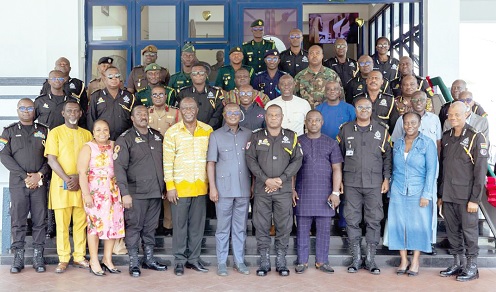 Christian Tetteh Yohuno (middle), with members of the NPP delegation and some schedule officers of the Ghana Police Service