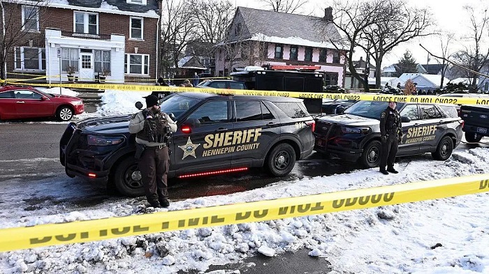 Law enforcement surrounds the area where an ICE agent fatally shot a woman in Minneapolis