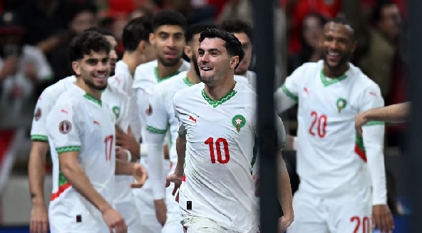 Morocco’s Brahim Díaz celebrates with teammates following the quarter-final win over Cameroon