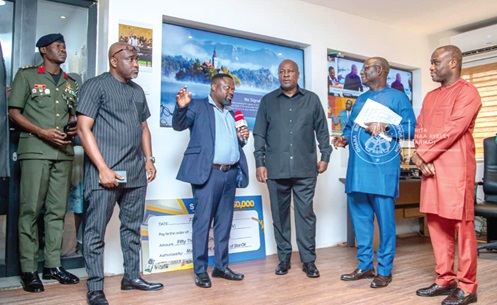 Mark Agodoa (4th from right), Head of GBC’s Digital Platform, briefing President John Dramani Mahama (3rd from right); Felix Kwakye Ofosu (right), Minister of Government Communications; Prof. Amin Alhassan (2nd from right), Director-General of GBC, and other dignitaries on the functions and activities of the Digital Studio Department, highlighting how it manages content creation, digital broadcasting and online engagement during a tour of the Social Media Office