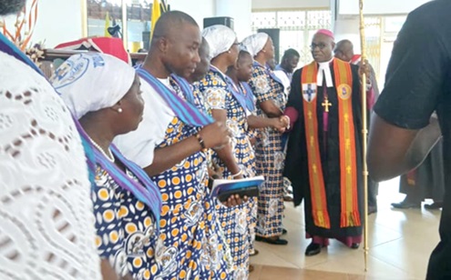 Presiding Bishop of The Methodist Church Ghana, Most Rev. Professor Johnson Kwabena Asamoah-Gyadu, congratulating the new Connexional officers of the Guild