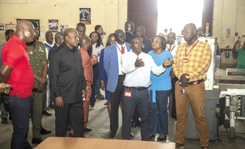 President John Dramani Mahama (2nd from left) and members of the entourage being given a technical briefing by Charles Amoako (3rd from right), Director of Technical Services, GCGL. Looking on are other officials of the GCGL