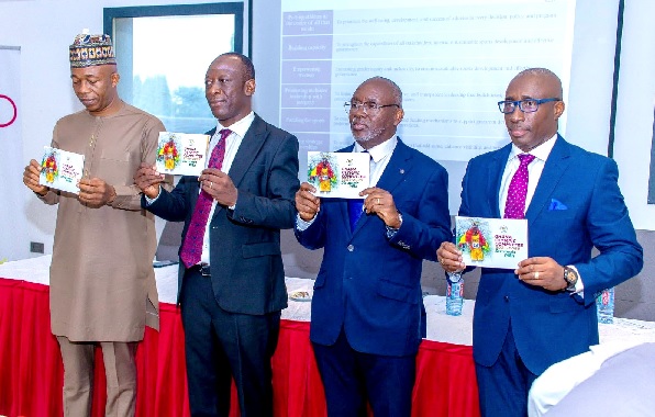 Richard Akpokavi (2nd right) President of the GOC and others unveiling the policy