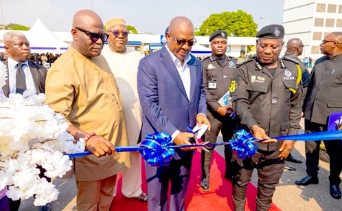 President John Dramani Mahama (middle) inaugurating the pickups before handing them over to the Ghana Police Service. Those with him are Ebenezer Okletey Terlabi (left), Deputy Minister for the Interior; Christian Tetteh Yohuno (right), Inspector General of Police, and other dignitaries 