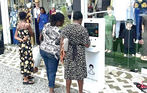 Some residents of Amasaman in the Greater Accra Region accessing one of the device developed by the scientists