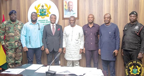 Emmanuel Armah-Kofi Buah (middle), Minister of Lands and Natural Resources, with some members of the National Timber Monitoring Team