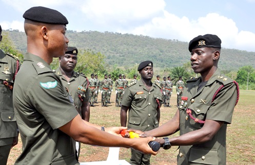 Lt Col Patrick Atuiri (right), outgoing CO of the Artillery Training School, Akoefe, presenting the baton-of-command to Lt Col Chris Quaye, the incoming CO­ of the school 
