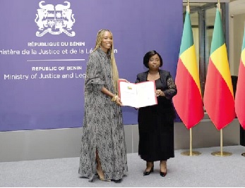  Isaline Attely, an Afro-descendant from Martinique, receiving her certificate of Beninese nationality during a naturalisation ceremony in Cotonou, Benin 