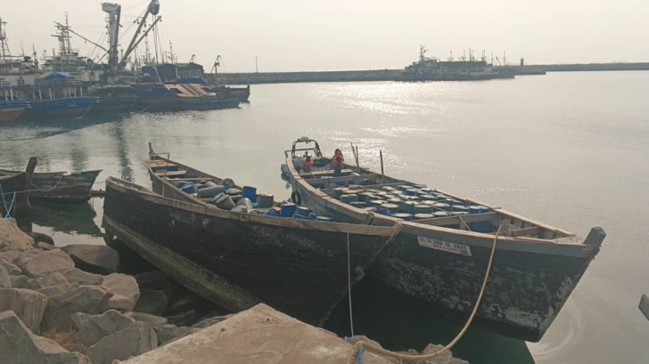 Some of the canoes and empty barrels towed to the Tema Harbour
