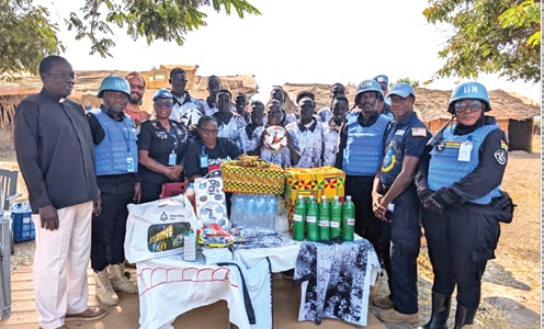 Chief Superintendent Rosina Gariba (arrowed), supported by other officers, presenting the sports items to the team