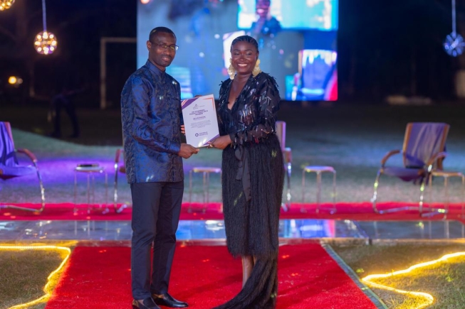 The MD giving an award to Rev Love Konadu, a voice to the mines