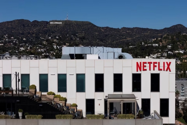 A drone view shows the Netflix logo on one of their buildings in the Hollywood neighborhood of Los Angeles, California, December 8, 2025. REUTERS/Daniel Cole/File Photo