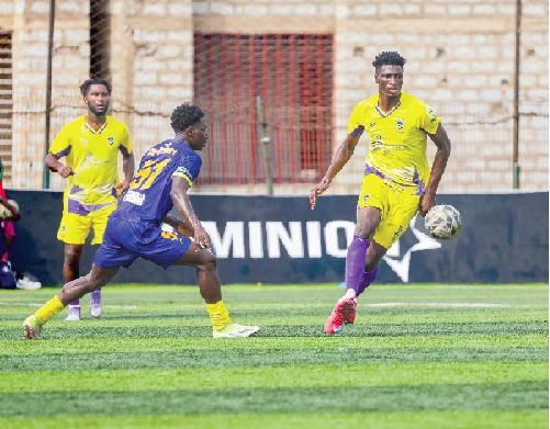 • Medeama’s Salim Adams gains control of the ball under pressure from his Vision FC marker