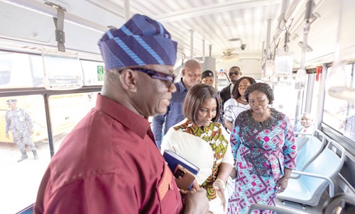 Vice-President Naana Jane Opoku-Agyemang (right) and some officials on one of the buses