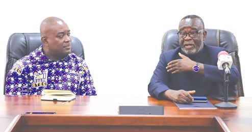 Justice Paul Baffoe-Bonnie (right), Chief Justice, explaining a point to Prof. Ahmed Jinapor, Director-General, GTEC, during the courtesy call