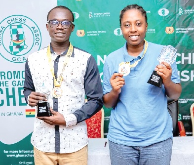 Bernard Anhwere (left) and Maud Benson, winners of the competition, displaying their trophies
