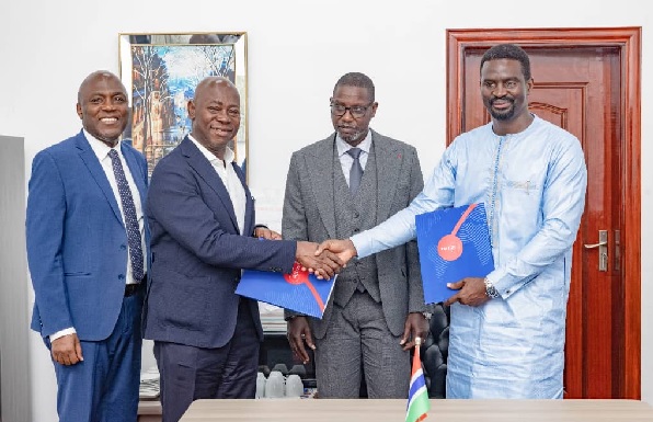 Moses Kwesi Baiden Jnr (2nd from left), CEO, Margins ID Group, exchanging the agreement with Matar Ceesay (right), Permanent Secretary of the Ministry of Interior. With them are Abdoulie Sanyang (2nd from right), Minister of Interior, The Gambia, and Kwesi Baiden (left), Deputy CEO, Margins ID Group