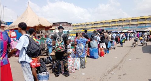 A long queue of travellers waiting for transport