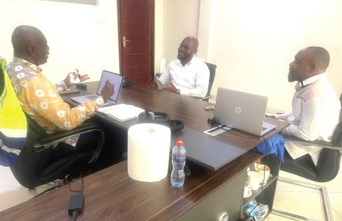 Theodore Ocansey (left), Monitoring and Enforcement Manager of the Ayalolo Bus Service, explaining a point in the meeting. Those with him are Joshua Bediako Koomson (middle), a Reporter with the Daily Graphic and Justice K. Safo (right). Public Relations Officer of the Ayalolo Bus Service 