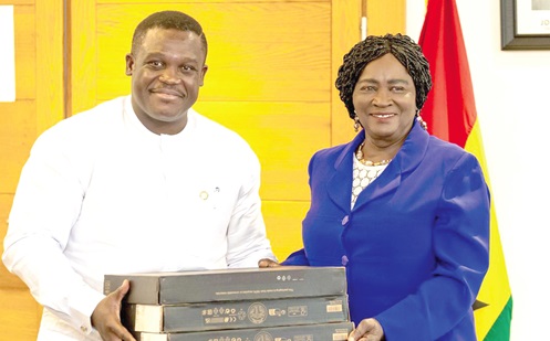 Prof. Naana Jane Opoku-Agyemang (right), Vice-President, receiving some gifts frame from Samuel Nartey George (left), Minister for Communi• Prof. Naana Jane Opoku-Agyemang (right), Vice-President, receiving some gifts frame from Samuel Nartey George (left), Minister for Communication, Digital Technology and Innovations, during her visit to the ministrycation, Digital Technology and Innovations, during her visit to the ministry