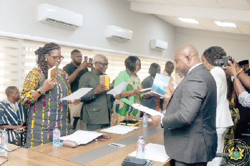 Members of the governing board taking the oath of office