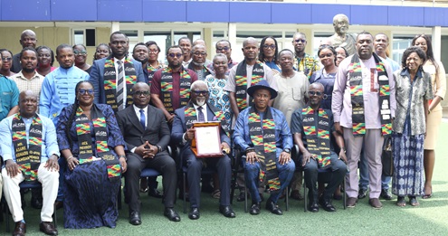 Edward Yaw Udzu (3rd from right), president, Ghana Publishers Association  (GPA), with Asare Konadu Yamoah (left), outgone president, GPA,  Kwabena Kodua Obiri-Yeboah (3rd from left), some members of GPA and family members after the induction ceremony. Picture: BENEDICT OBUOBI